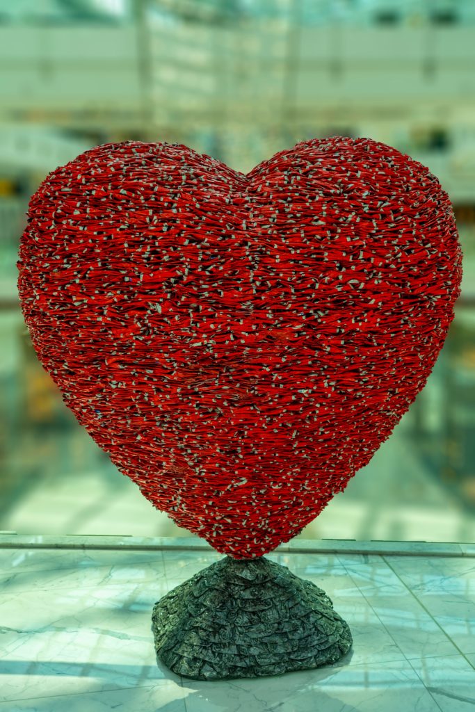 red heart shaped ornament on glass table