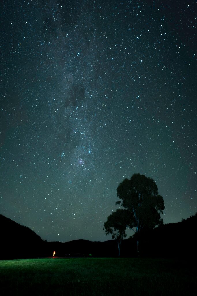 Stunning view of the Milky Way at Somerset Dam with a starry sky and silhouette landscape.